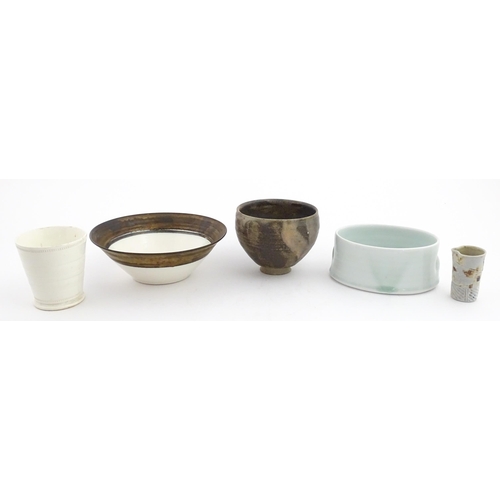 194 - Four studio pottery items to include an oval bowl by Antje Ernestus, a bowl by Richard Baxter, a sma... 