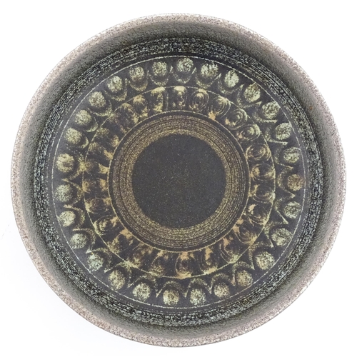 195 - A large Spanish studio pottery bowl with banded decoration, signed Serra. Approx. 12