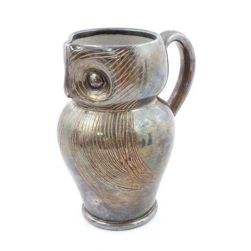 199 - An Arts & Crafts Farnham pottery style owl jug with silver plate overlay. Unmarked. Approx. 6 3/4