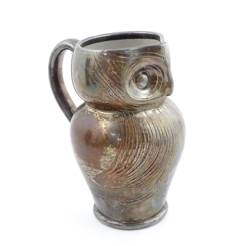199 - An Arts & Crafts Farnham pottery style owl jug with silver plate overlay. Unmarked. Approx. 6 3/4
