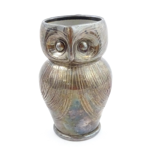 199 - An Arts & Crafts Farnham pottery style owl jug with silver plate overlay. Unmarked. Approx. 6 3/4