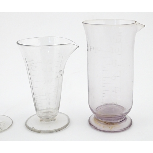 241 - A quantity of assorted 19thC and later drinking glasses together with two measuring jugs / beakers w... 