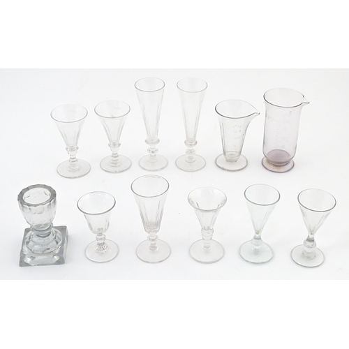 241 - A quantity of assorted 19thC and later drinking glasses together with two measuring jugs / beakers w... 