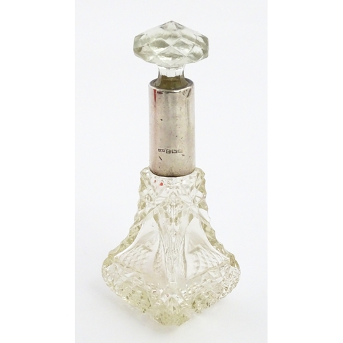 232 - A quantity of perfume / scent bottles together with a dressing table pot etc. One scent bottle havin... 