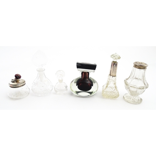 232 - A quantity of perfume / scent bottles together with a dressing table pot etc. One scent bottle havin... 