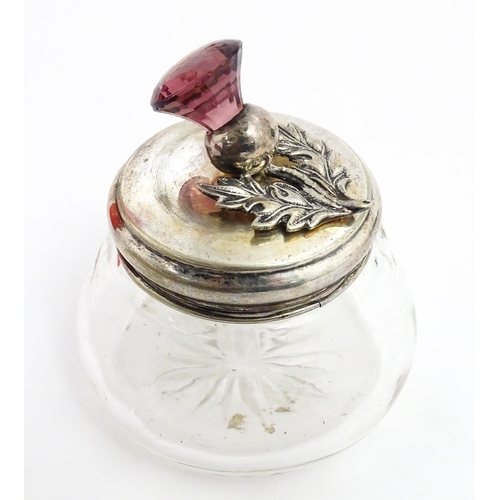 232 - A quantity of perfume / scent bottles together with a dressing table pot etc. One scent bottle havin... 