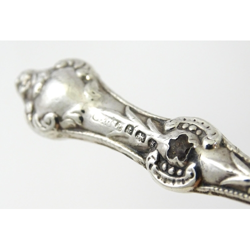 494 - Four various silver handled button hooks. To include examples hallmarked Birmingham 1898 maker Adie ... 