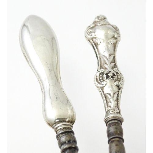 494 - Four various silver handled button hooks. To include examples hallmarked Birmingham 1898 maker Adie ... 