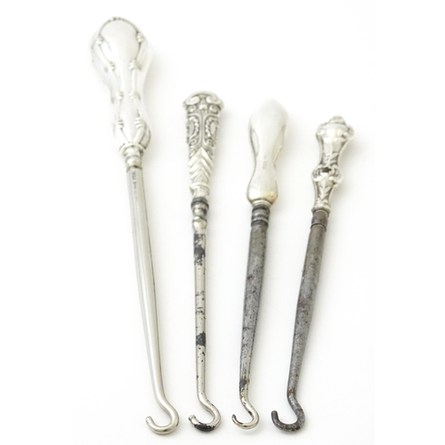 494 - Four various silver handled button hooks. To include examples hallmarked Birmingham 1898 maker Adie ... 