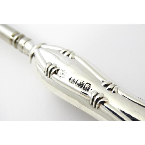 494 - Four various silver handled button hooks. To include examples hallmarked Birmingham 1898 maker Adie ... 