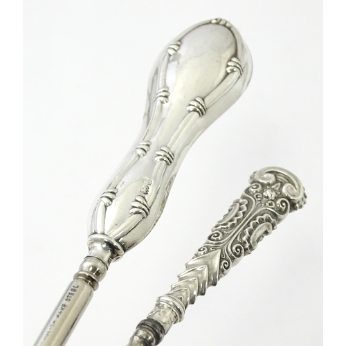 494 - Four various silver handled button hooks. To include examples hallmarked Birmingham 1898 maker Adie ... 