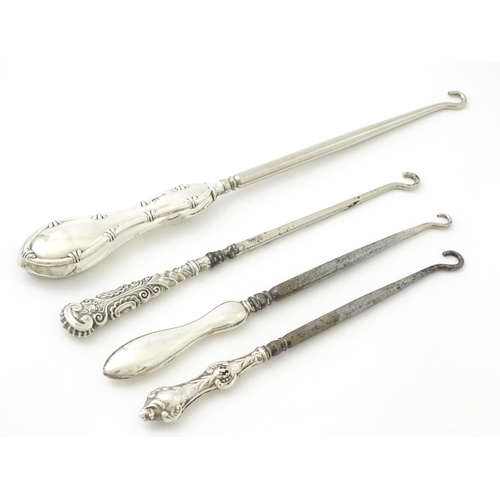 494 - Four various silver handled button hooks. To include examples hallmarked Birmingham 1898 maker Adie ... 