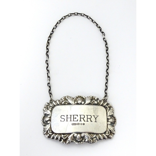 497 - A silver decanter / wine label / bottle ticket for Sherry hallmarked London 1993, maker Richards & K... 