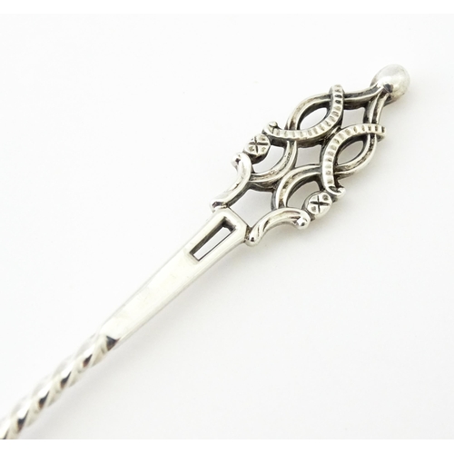 513 - A Victorian silver sugar spoon with shell formed bowl and openwork detail, hallmarked London 1894, m... 