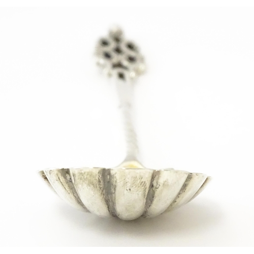513 - A Victorian silver sugar spoon with shell formed bowl and openwork detail, hallmarked London 1894, m... 