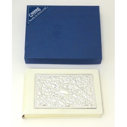 514 - A photograph album with embossed silver mount hallmarked Sheffield 2000, maker Carrs of Sheffield. B... 