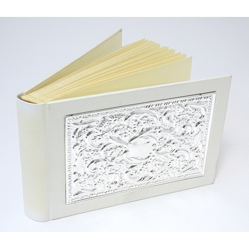514 - A photograph album with embossed silver mount hallmarked Sheffield 2000, maker Carrs of Sheffield. B... 