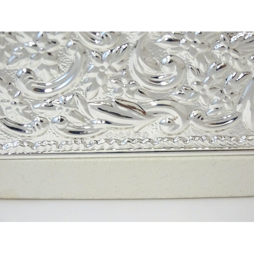 514 - A photograph album with embossed silver mount hallmarked Sheffield 2000, maker Carrs of Sheffield. B... 