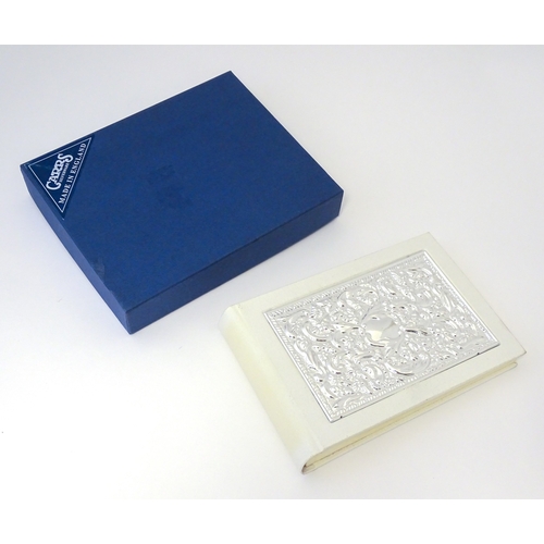 514 - A photograph album with embossed silver mount hallmarked Sheffield 2000, maker Carrs of Sheffield. B... 
