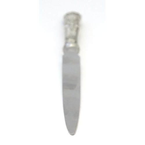 515 - A silver handled paper knife / letter opener. Approx. 8 1/4