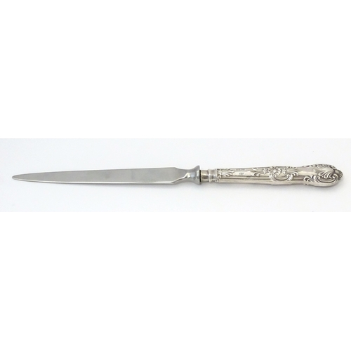 515 - A silver handled paper knife / letter opener. Approx. 8 1/4
