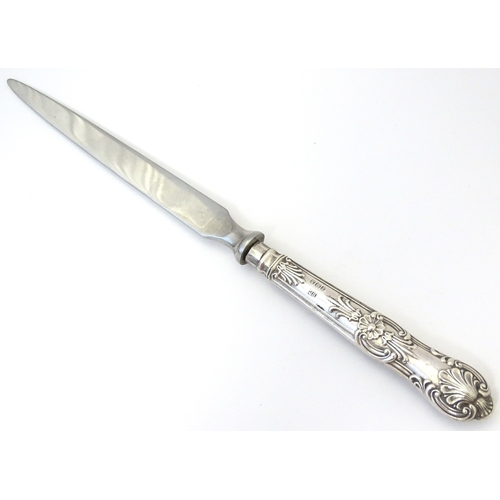 515 - A silver handled paper knife / letter opener. Approx. 8 1/4