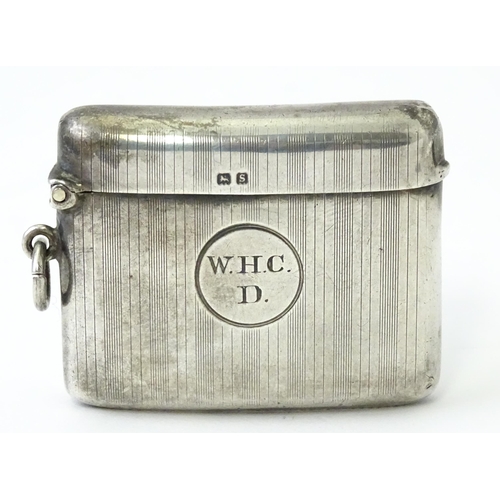 359 - A silver vesta case with engine turned decoration, hallmarked Birmingham 1917, maker Henry Matthews.... 