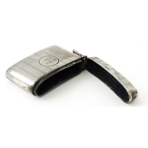 359 - A silver vesta case with engine turned decoration, hallmarked Birmingham 1917, maker Henry Matthews.... 