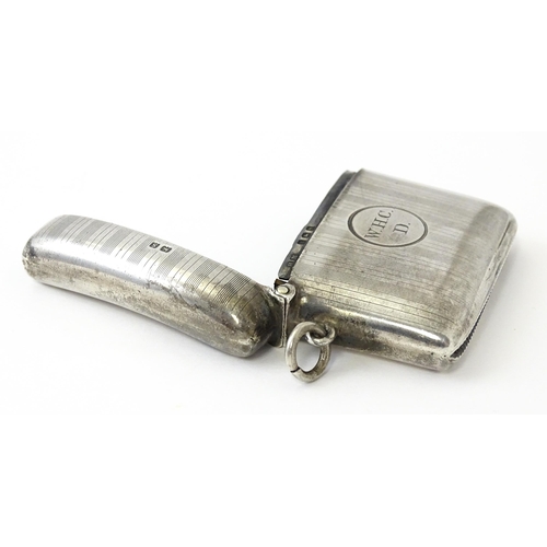 359 - A silver vesta case with engine turned decoration, hallmarked Birmingham 1917, maker Henry Matthews.... 