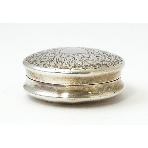 361 - A Victorian silver pill box with engraved decoration hallmarked Birmingham 1895, maker Hilliard & Th... 