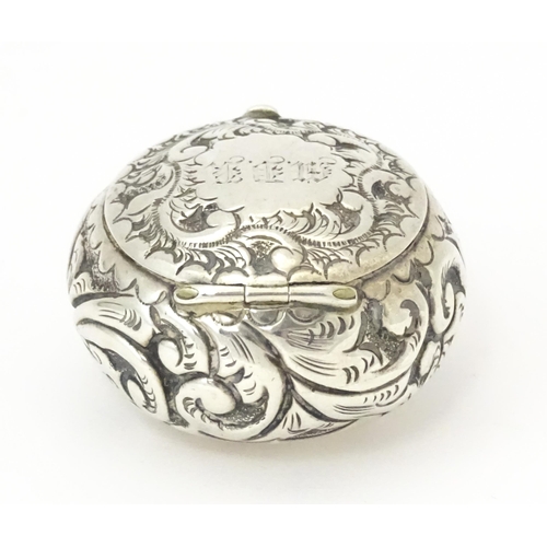 364 - A Victorian silver pill pot with embossed decoration, hallmarked Birmingham 1896, maker Cornelius De... 