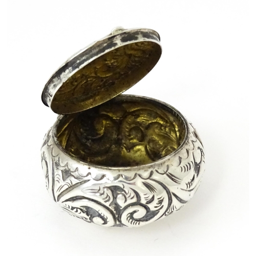 364 - A Victorian silver pill pot with embossed decoration, hallmarked Birmingham 1896, maker Cornelius De... 