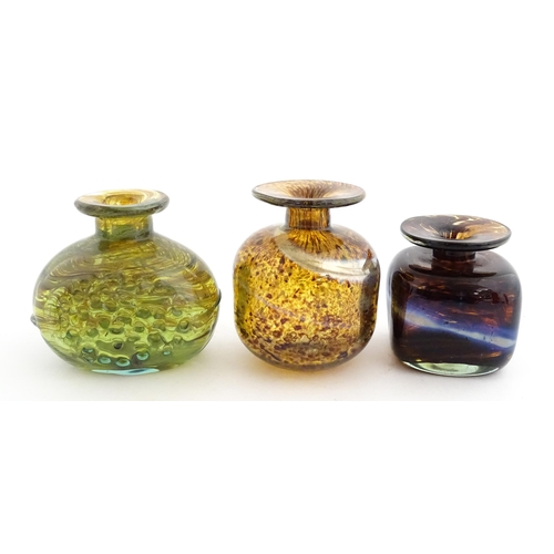212 - A Mdina glass squat vase, signed under. Together with two further art / studio glass vases, one with... 