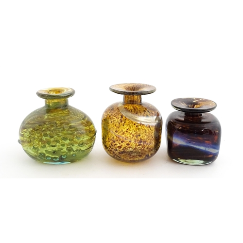 212 - A Mdina glass squat vase, signed under. Together with two further art / studio glass vases, one with... 
