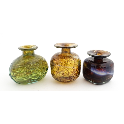 212 - A Mdina glass squat vase, signed under. Together with two further art / studio glass vases, one with... 