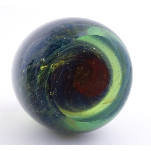 215 - A Mdina glass paperweight signed under. Together with a Mdina glass Tiger pattern vase, Unsigned. Th... 