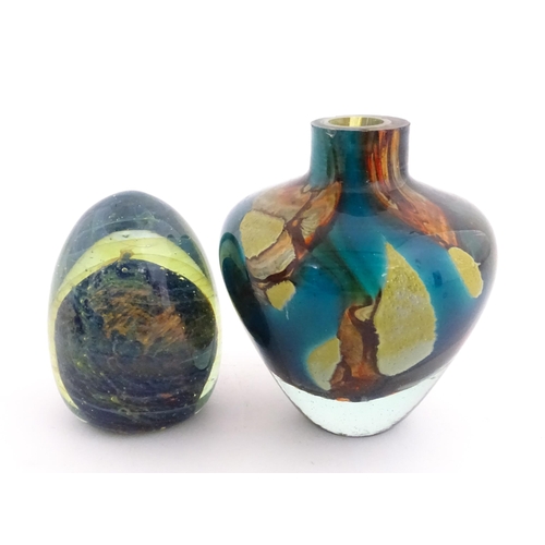 215 - A Mdina glass paperweight signed under. Together with a Mdina glass Tiger pattern vase, Unsigned. Th... 
