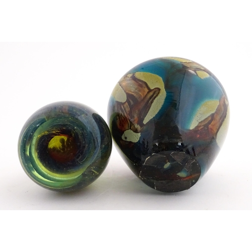 215 - A Mdina glass paperweight signed under. Together with a Mdina glass Tiger pattern vase, Unsigned. Th... 