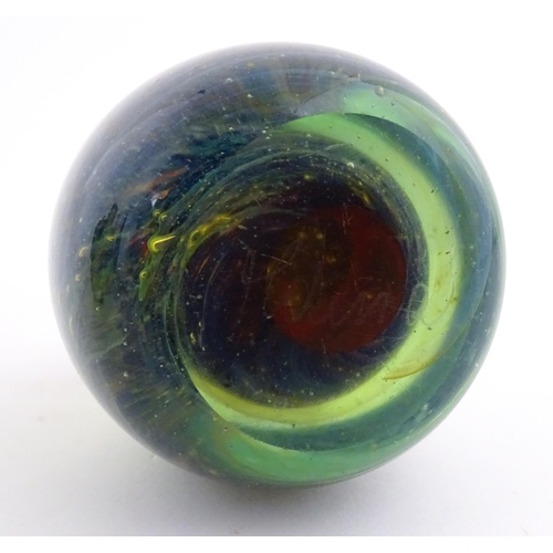 215 - A Mdina glass paperweight signed under. Together with a Mdina glass Tiger pattern vase, Unsigned. Th... 