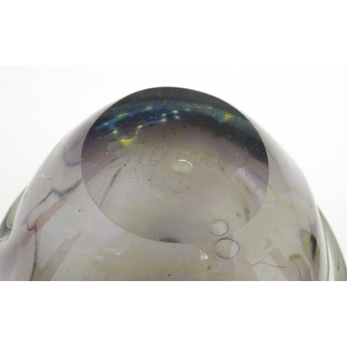 216 - Three Mdina glass items comprising an orange Helter Skelter style vase, a pulled ear vase and an Ear... 