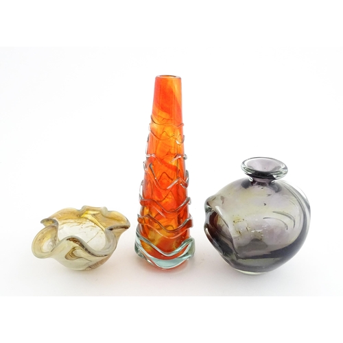 216 - Three Mdina glass items comprising an orange Helter Skelter style vase, a pulled ear vase and an Ear... 