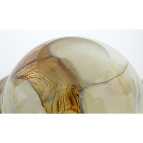 216 - Three Mdina glass items comprising an orange Helter Skelter style vase, a pulled ear vase and an Ear... 