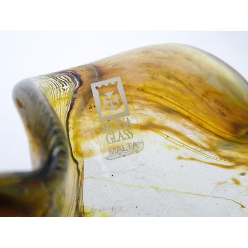 216 - Three Mdina glass items comprising an orange Helter Skelter style vase, a pulled ear vase and an Ear... 