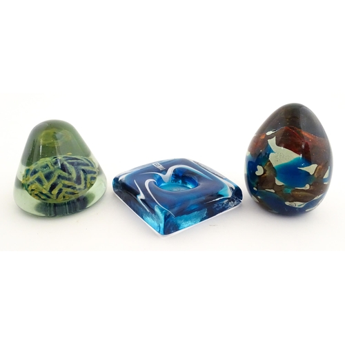 219 - Three Mdina glass items comprising a dump paperweight with chevron detail, a Tiger pattern paperweig... 
