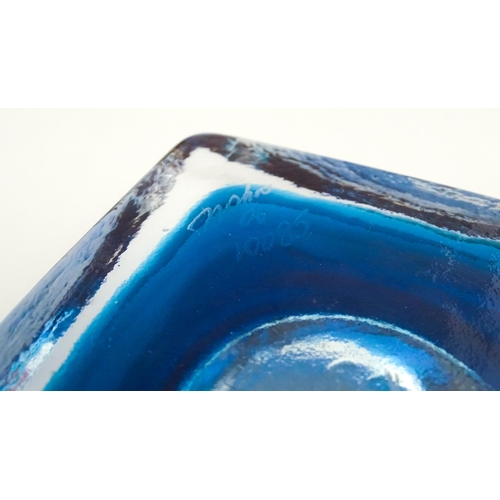 219 - Three Mdina glass items comprising a dump paperweight with chevron detail, a Tiger pattern paperweig... 