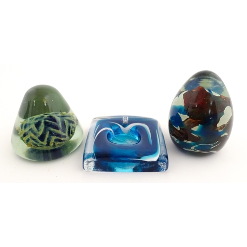 219 - Three Mdina glass items comprising a dump paperweight with chevron detail, a Tiger pattern paperweig... 