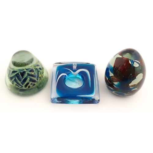 219 - Three Mdina glass items comprising a dump paperweight with chevron detail, a Tiger pattern paperweig... 