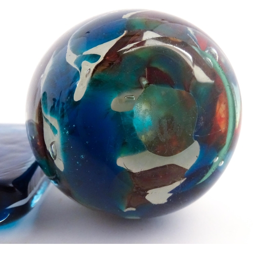 219 - Three Mdina glass items comprising a dump paperweight with chevron detail, a Tiger pattern paperweig... 