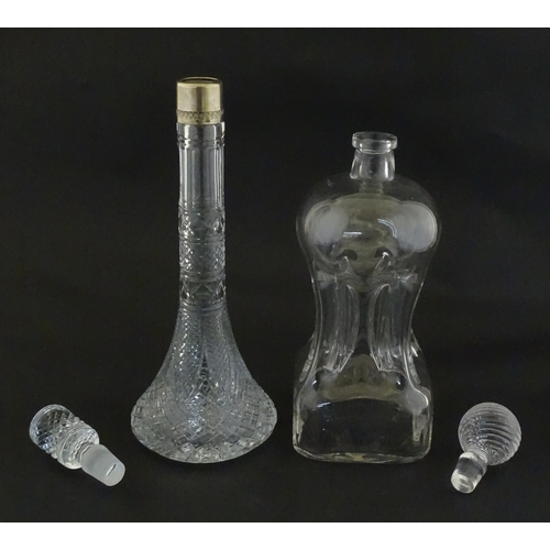 230 - Two decanters, one with Russian silver collar, the other with pinch detail. The tallest approx 13