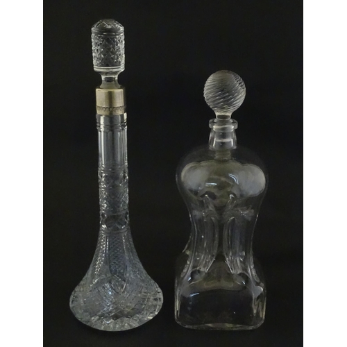230 - Two decanters, one with Russian silver collar, the other with pinch detail. The tallest approx 13